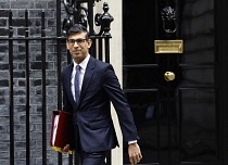 England, London, Conservative Prime Minister exiting the door of number 10 Downing Street.