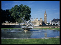 England, London, Westminster  The Houses of Parliament and Big Ben seen from St Thomas Hospital with revolving fountain in the foreground.