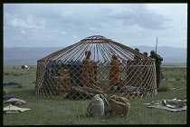 Afghanistan, General, Kirghiz building circular frame for yurt.