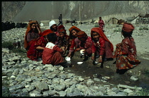Afghanistan, General, Kirghiz women and children washing dishes in stream.