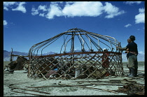 Afghanistan, General, Nomadic Kirghiz men and women building frame for traditional ger.