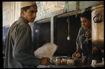 Afghanistan, General, Man and boy at village tea stall.