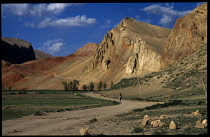 Afghanistan, Yakawlang District, General, Band i Amir to Bamiyan road through mountainous landscape with distant donkey rider.