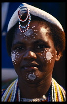 SOUTH AFRICA, Western Cape, Cape Town, Portrait of guest at state opening of Parliament with painted facial decoration.