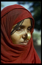 ETHIOPIA, Body Decoration, Portrait of a young woman with nose decoration.