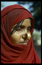 ETHIOPIA, Body Decoration, Portrait of a young woman with nose decoration.