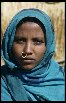 SUDAN, Darfur Province, Kababish tribeswoman wearing headscarf and hooped nose ring.