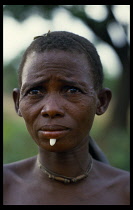 TOGO, People, Body Decoration, Tamberma woman wearing ivory lip plug.