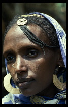 ERITREA, Body Decoration, Portrait of woman with pierced nose and facial scarification.