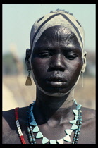 SUDAN, Body Decoration, Portrait of Dinka woman with facial scarification and body paint.