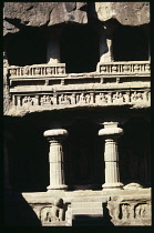 India, Maharashtra, Ellora Caves, Cave 16 The Kailasa Temple.  Detail of galleries and carvings carved into rock face.