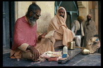 India, Rajasthan, Pushkar, Sadhu reading from Holy book.