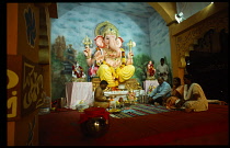 India, Andhra Pradesh, Hyderabad, Hindu devotees seeking a blessing from Ganesh the elephant god through priest at the Ganesh Chaturthi festival which is ten days of music dance theatre and feasting.