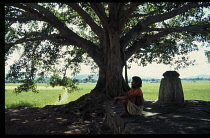 India, Andhra Pradesh, General, Sadhu meditating beneath holy Bodhi tree.