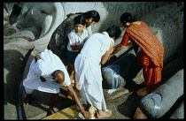 India, General, Jains worshipper poouring milk over Gomatesh Vara Statue Shravana Belagola Jain Puja.
