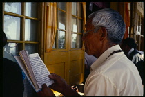 India, Himachal Pradesh, Dharamsala, Buddhists chanting scriptures.