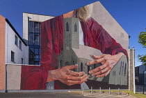 Ireland, County Wexford, New Ross, Mural depicting Strongbow's daughter Isabel de Clare holding and protecting St Mary's Church, where her heart is reputed to be buried, this is the work of artist Cas...