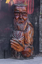 Ireland, County Waterford, Waterford city, King of the Vikings cultural centre, carved figure at the building's gable.