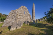 Ireland, County Waterford,  Ardmore, St Declan's Monastic site, Ardmore  Cathedral, the west gable with its carved arcades and the round tower behind.