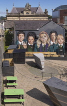 Northern Ireland, Co.Derry, Derry city, Mural on Badger's Bar featuring the cast of Derry Girls, a Channel 4 comedy series which follows a group of five secondary school students navigating adolescenc...