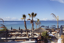 France, Provence-Alps, Cote d'Azur, Antibes Juan-les-Pins, Beach with tourists sunbathing and swimming in the sea.