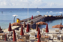 France, Provence-Alps, Cote d'Azur, Antibes Juan-les-Pins, Beach with tourists sunbathing and swimming in the sea.