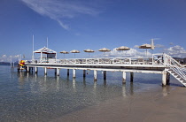 France, Provence-Alps, Cote d'Azur, Antibes Juan-les-Pins, Beach with jetty for sunbathing next to the sea.