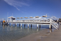 France, Provence-Alps, Cote d'Azur, Antibes Juan-les-Pins, Beach with jetty for sunbathing next to the sea.