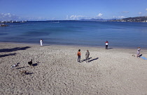 France, Provence-Alps, Cote d'Azur, Antibes Juan-les-Pins, Beach with dogs being exercised in the early morning
