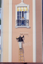 France, Provence-Alps, Cote d'Azur, Antibes Juan-les-Pins, Ornately painted building gable wall.