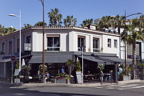 France, Provence-Alps, Cote d'Azur, Antibes Juan-les-Pins, Exterior of cafe bar with outdoor seating.