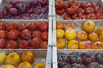 France, Provence-Alps, Cote d'Azur, Antibes, Provencal food market display of ripe heritage tomatoes.