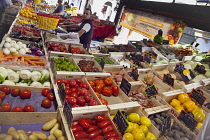 France, Provence-Alps, Cote d'Azur, Antibes, Provencal food market busy with tourists and locals buying fresh fruit and vegetables.