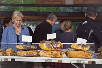 France, Provence-Alps, Cote d'Azur, Antibes, Provencal food market busy with tourists and locals buying dried and cured meats.