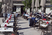 France, Provence-Alps, Cote d'Azur, Antibes, People sat outside cafes in Place Nationale.