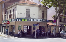 France, Provence-Alps, Cote d'Azur, Antibes, Locals sat outside cafe in the old town.