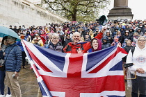 England, London, The Mall,  people celebrating the coronation of King Charles III on a rainy May 6th 2023.