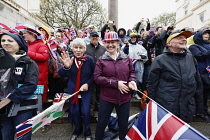 England, London, The Mall,  people celebrating the coronation of King Charles III on a rainy May 6th 2023.