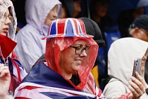 England, London, The Mall,  people celebrating the coronation of King Charles III on a rainy May 6th 2023.