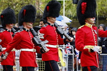 England, London, The Mall, Grenadier Guards marching during the coronation of Kings Charles III on a rainy May 6th 2023.
