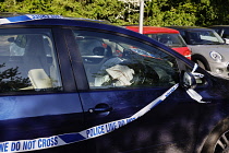 Transport, Road, Car with police tape after being involved in an accident, Cranbrook, Kent, England.