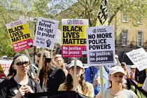 England, London, Westminster, Protesters marching outside Downing Street.