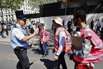 England, London, Westminster, Protesters marching outside Downing Street, Police Liaison officers engaging with a religious protestors.