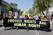 England, London, Westminster, Protesters marching outside Downing Street.