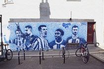 England, East Sussex, Hove, Western Road, Mural of the Brighton & Hove Albion football team members on gable wall on Farm Road.