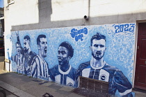 England, East Sussex, Hove, Western Road, Mural of the Brighton & Hove Albion football team members on gable wall on Farm Road.