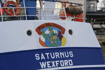 England, Hampshire, Portsmouth, Irish fishing boat in harbour with Pog Mo Thoin and Leprechaun painted above name.