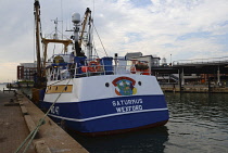 England, Hampshire, Portsmouth, Irish fishing boat in harbour with Pog Mo Thoin and Leprechaun painted above name.