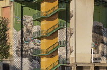 Spain, Basque Country, Bilbao, Mural and stairway underneath Puente de la Salve.