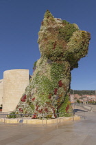 Spain, Basque Country, Bilbao, Guggenheim Museum area, Puppy which is a 12.4 metre tall flower covered sculpture of a west highland terrier by American artist Jeff Koons.